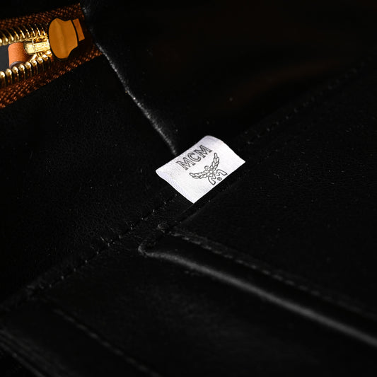 MCM Stark Visetos Medium Backpack – Cognac Monogram with Gold-Tone Studs