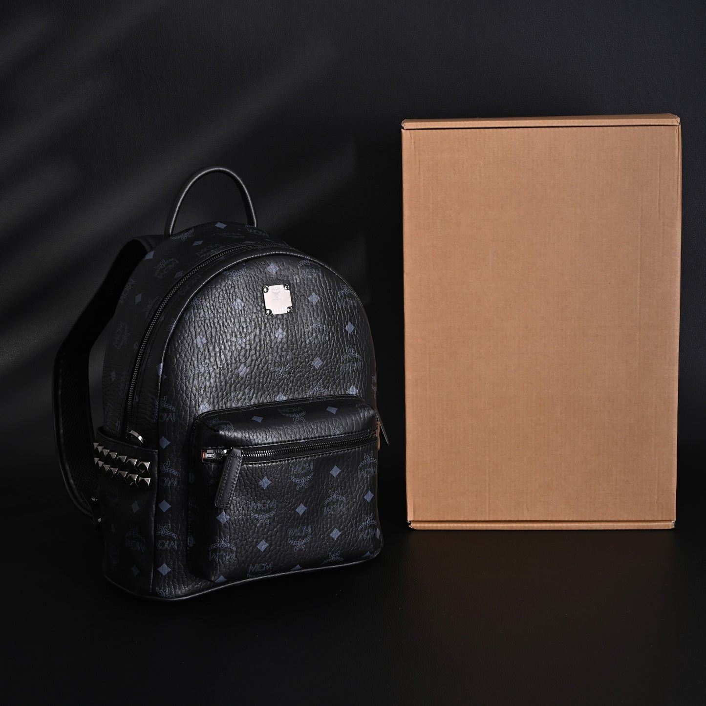 MCM Stark Visetos Medium Backpack – Black Monogram with Studded Detailing