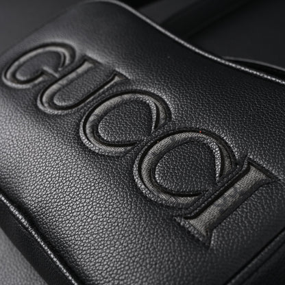 Gucci Black Leather Embossed Logo Belt Bag