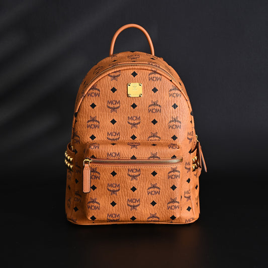 MCM Stark Visetos Medium Backpack – Cognac Monogram with Gold-Tone Studs
